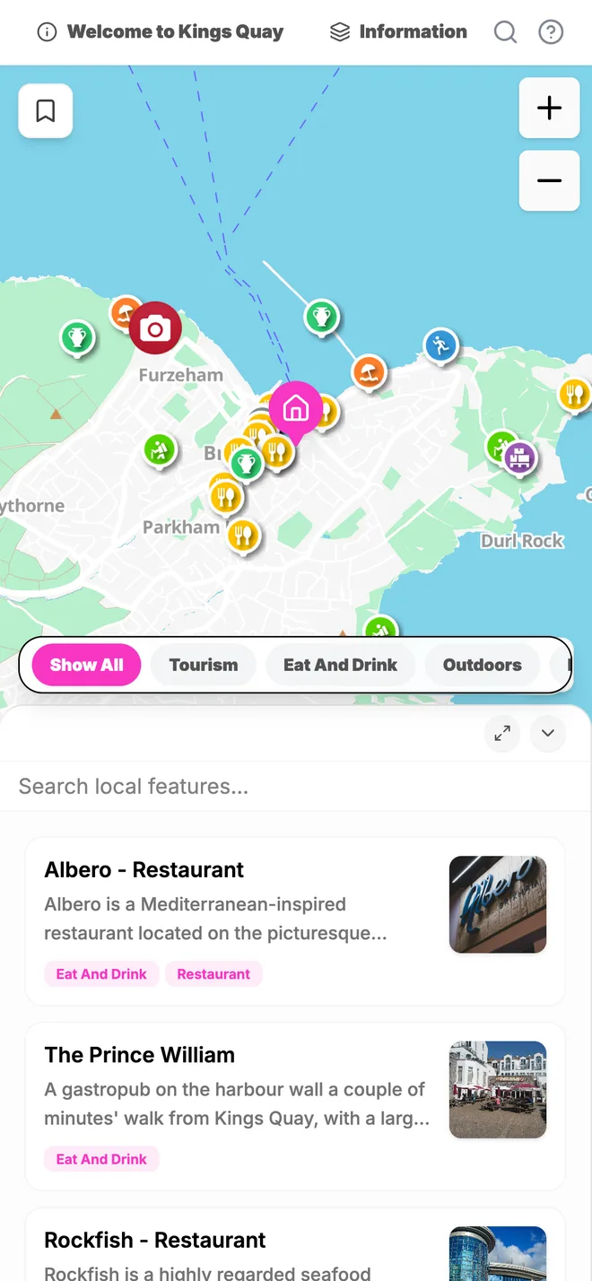 The guide's local map on a phone: the house marked on Brixham harbour with places to eat and things to do around it.